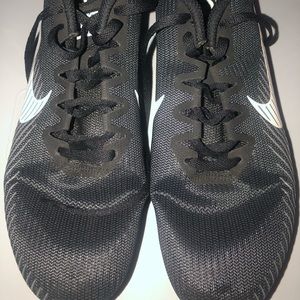 Black and white Nike mens track spikes size 9